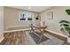 Home office with wood desk, window, and wood-look flooring at 2 Garfield St # B, Denver, CO 80206