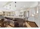 Spacious kitchen featuring granite countertops, stainless steel appliances, and an island with seating at 2 Garfield St # B, Denver, CO 80206