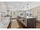Modern kitchen with long island, granite countertops, and stainless steel appliances at 2 Garfield St # B, Denver, CO 80206