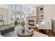 Bright living room with hardwood floors, a fireplace and large windows at 2 Garfield St # B, Denver, CO 80206