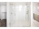 Bright bathroom featuring a walk-in glass shower with dual showerheads and modern vanities at 5392 Lions Paw St, Castle Rock, CO 80104