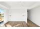 Bright bedroom with modern sconces and hardwood floors at 5392 Lions Paw St, Castle Rock, CO 80104
