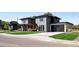 Beautiful two-story home featuring modern gray brick, manicured lawn, and a spacious driveway leading to an attached garage at 5392 Lions Paw St, Castle Rock, CO 80104