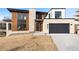 Stunning modern home with a stone and wood facade and a spacious two-car garage at 5392 Lions Paw St, Castle Rock, CO 80104
