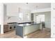 Modern kitchen with stainless steel appliances and large island at 5392 Lions Paw St, Castle Rock, CO 80104