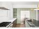 Contemporary kitchen with stainless steel refrigerator and view of kitchen island at 5392 Lions Paw St, Castle Rock, CO 80104