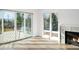 Bright living room featuring sliding doors and fireplace at 5392 Lions Paw St, Castle Rock, CO 80104