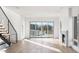 Open floor plan featuring a marble fireplace and sliding glass doors at 5392 Lions Paw St, Castle Rock, CO 80104