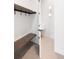 Mudroom with bench and coat hooks, and stylish flooring at 5392 Lions Paw St, Castle Rock, CO 80104