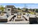 Comfortable rooftop patio features ample seating and a cozy fire pit, perfect for entertaining at 5392 Lions Paw St, Castle Rock, CO 80104