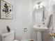 Stylish powder bathroom with a pedestal sink and decorative accents at 12860 E Dickensen Pl, Aurora, CO 80014