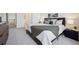 Spacious bedroom with neutral carpet, a stylish throw blanket, and ensuite bathroom at 12860 E Dickensen Pl, Aurora, CO 80014