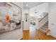 Bright foyer with hardwood floors and stairway leading to the upper level at 12860 E Dickensen Pl, Aurora, CO 80014