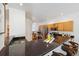 Bright kitchen featuring a large island, stainless steel appliances, and wooden cabinets at 12860 E Dickensen Pl, Aurora, CO 80014