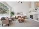 Spacious living room with vaulted ceilings, fireplace, and large windows at 12860 E Dickensen Pl, Aurora, CO 80014
