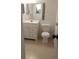 Compact bathroom with a vanity and toilet offers essential amenities at 10211 Ura Ln # 101, Thornton, CO 80260