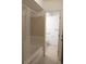 Bathroom with a shower-tub combination featuring tile surround and shower curtain at 10211 Ura Ln # 101, Thornton, CO 80260
