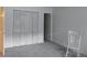 A bedroom with a closet and bright window creates a serene space at 10211 Ura Ln # 101, Thornton, CO 80260