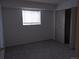 Neutral bedroom with a closet and a window at 10211 Ura Ln # 101, Thornton, CO 80260