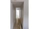 Hallway featuring tile floors with neutral walls at 10211 Ura Ln # 101, Thornton, CO 80260