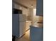 Functional kitchen with white appliances and cabinetry offering ample storage space at 10211 Ura Ln # 101, Thornton, CO 80260