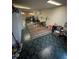 Spacious basement area with dark tiled floors and ample storage, perfect for a home gym or recreation space at 8278 Cherokee St, Denver, CO 80221