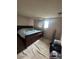 Cozy bedroom with a comfortable queen-size bed and soft carpet flooring at 8278 Cherokee St, Denver, CO 80221