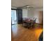 Inviting dining area featuring hardwood floors and a sliding glass door leading to an outdoor space at 8278 Cherokee St, Denver, CO 80221