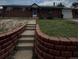 Charming red brick ranch-style home with a well-maintained lawn and inviting front entrance at 8278 Cherokee St, Denver, CO 80221