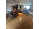 Spacious living room with hardwood floors, a cozy fireplace, and large windows that offer abundant natural light at 8278 Cherokee St, Denver, CO 80221