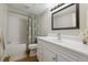 Bathroom featuring a shower, toilet, vanity, and mirror at 9700 E Iliff Ave # 81, Denver, CO 80231
