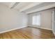 Bright bedroom featuring wood floors, a window, and modern interior design at 9700 E Iliff Ave # 81, Denver, CO 80231
