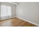 Cozy bedroom with hardwood floors, neutral walls, and natural light at 9700 E Iliff Ave # 81, Denver, CO 80231