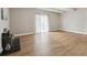 Bright living room featuring wood floors, light walls, and a fireplace at 9700 E Iliff Ave # 81, Denver, CO 80231