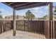 Patio featuring a fence with view of building and trees at 9700 E Iliff Ave # 81, Denver, CO 80231