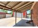 Covered back patio of brick house with attached garage at 11085 Clarkson St, Northglenn, CO 80233