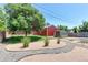 Gravel and rock backyard featuring garage, shed, and tidy landscaping at 11085 Clarkson St, Northglenn, CO 80233