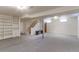 Spacious carpeted basement features built-in shelving, stairs, and windows providing ample natural light at 11085 Clarkson St, Northglenn, CO 80233