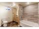 Modern bathroom boasting stylish tiled shower, natural wood vanity, and modern fixtures at 11085 Clarkson St, Northglenn, CO 80233