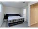 Cozy bedroom featuring plush bed with black headboard, lamps, and closet at 11085 Clarkson St, Northglenn, CO 80233