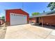 Exterior view of brick home with large garage and covered back patio area at 11085 Clarkson St, Northglenn, CO 80233