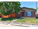 Charming red brick home with a well-maintained front yard and mature tree at 11085 Clarkson St, Northglenn, CO 80233