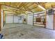 Spacious garage with overhead lighting, exposed beams, and white insulation panels at 11085 Clarkson St, Northglenn, CO 80233