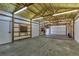 Large garage interior with insulation, fluorescent lighting, and multiple doors at 11085 Clarkson St, Northglenn, CO 80233