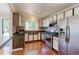 Modern kitchen with stainless steel appliances, updated cabinets, and stylish backsplash at 11085 Clarkson St, Northglenn, CO 80233
