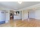 Open concept living area with hardwood floors flows into a modern kitchen at 11085 Clarkson St, Northglenn, CO 80233