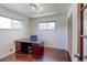 Home office or bedroom space with natural light and sleek floors at 11085 Clarkson St, Northglenn, CO 80233
