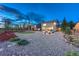 Serene backyard with decorative rock cover, garden, and firepit area enhances outdoor living and entertaining at 17050 Park Trail Dr, Monument, CO 80132
