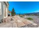 Spacious backyard with stone patio, firepit, and mountain views perfect for outdoor entertainment and relaxation at 17050 Park Trail Dr, Monument, CO 80132