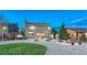 Expansive backyard featuring a firepit, patio seating, lush landscaping, and well-maintained lawn offers outdoor enjoyment at 17050 Park Trail Dr, Monument, CO 80132
